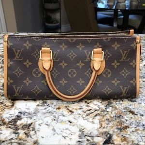 Authentic Louis Vuitton Triangle Bag